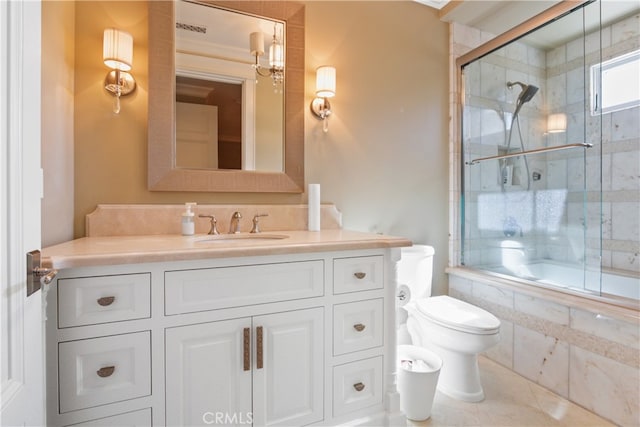 full bathroom with vanity, combined bath / shower with glass door, toilet, and tile patterned floors