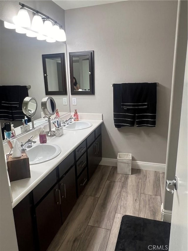 bathroom with hardwood / wood-style flooring and vanity