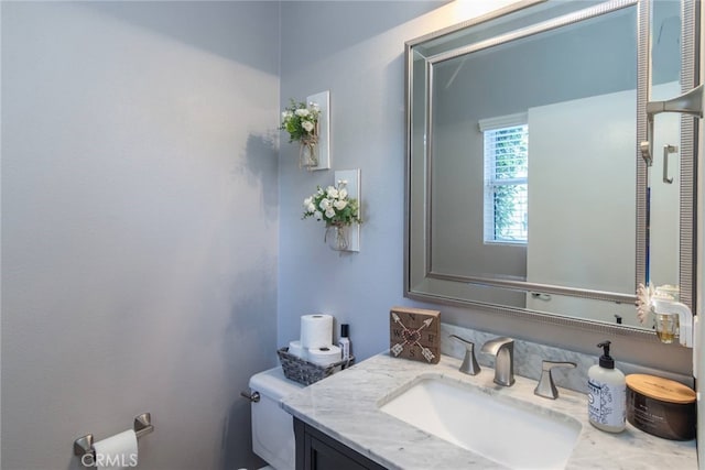 half bath with vanity and toilet