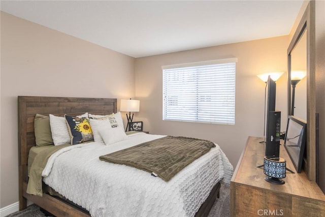 bedroom featuring baseboards
