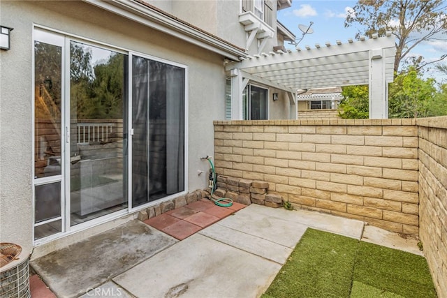 view of patio featuring fence and a pergola