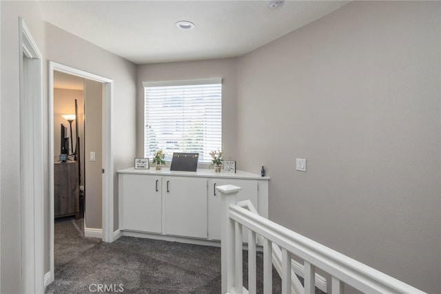 23014 Cheyenne Dr Unit 151, Valencia, CA 91354 - hallway with dark carpet, an upstairs landing, and baseboards