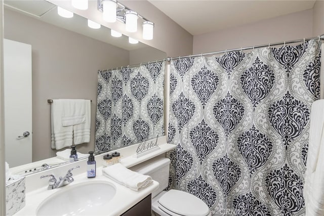 bathroom featuring vanity, a shower with curtain, and toilet