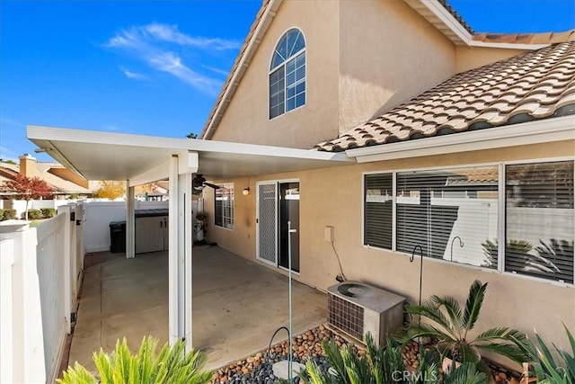 back of house featuring a patio and cooling unit