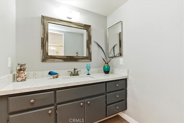 bathroom featuring vanity and hardwood / wood-style flooring