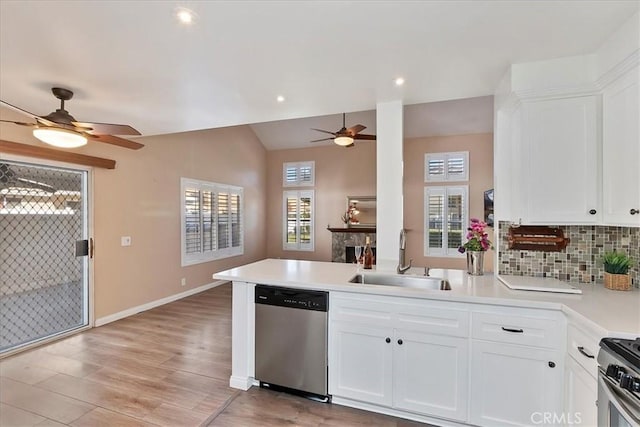 kitchen featuring white cabinetry, light wood-type flooring, sink, and appliances with stainless steel finishes