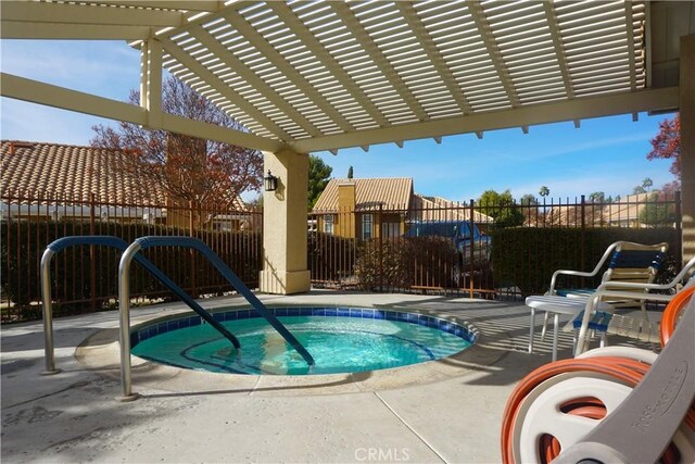 view of pool featuring a pergola and a hot tub