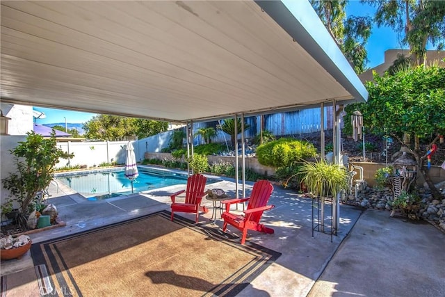 view of swimming pool featuring a patio area