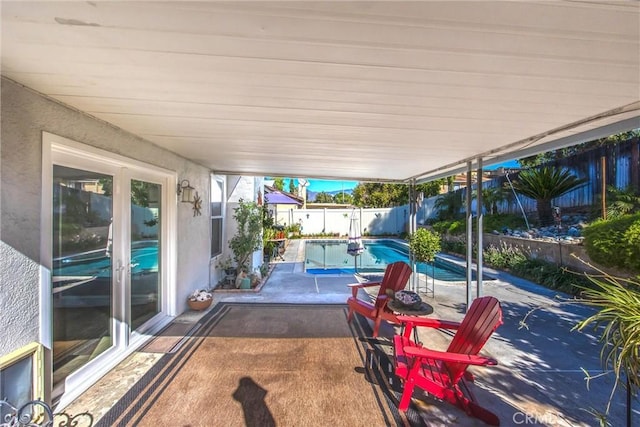 view of patio featuring a fenced in pool