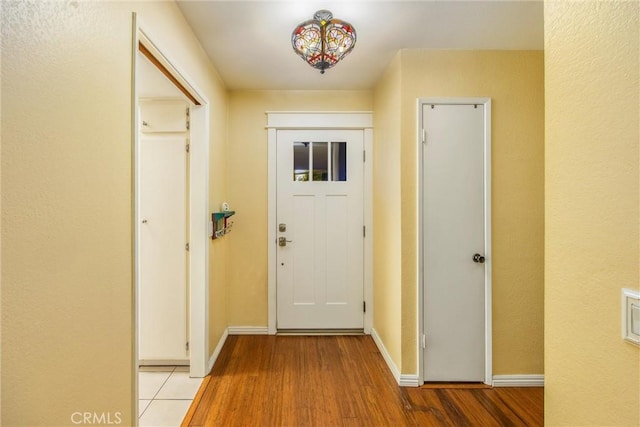 entryway with light hardwood / wood-style floors