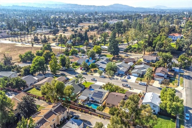 birds eye view of property with a mountain view