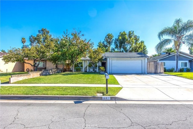 view of front of property featuring a garage and a front yard