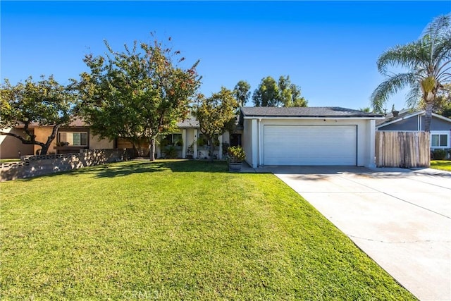 ranch-style house featuring a front yard and a garage