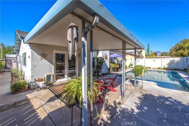 view of patio / terrace featuring a fenced in pool