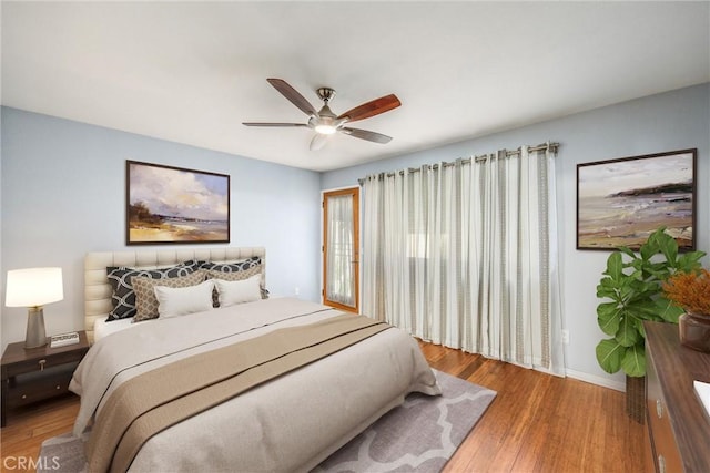 bedroom with hardwood / wood-style floors and ceiling fan