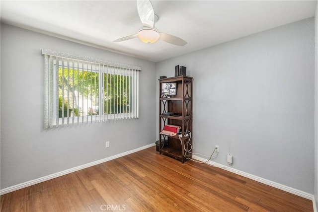 empty room featuring ceiling fan and wood-type flooring