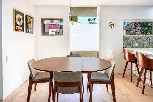 dining space with light wood-type flooring