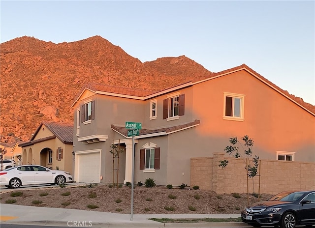 view of front of house featuring a mountain view and a garage