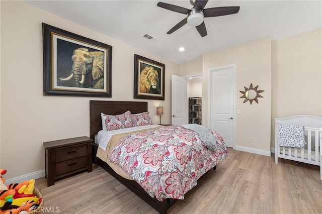 bedroom featuring ceiling fan and light hardwood / wood-style floors