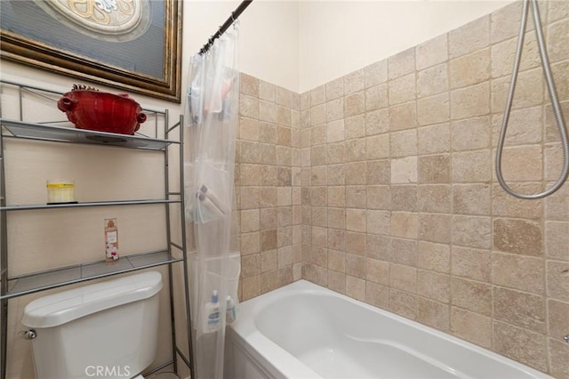 bathroom featuring shower / tub combo with curtain and toilet