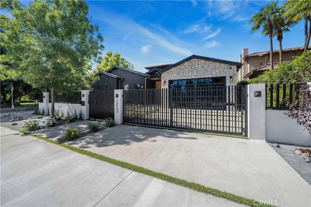 view of gate with a garage