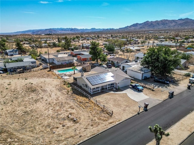 6277 Linda Lee Dr, Yucca Valley, CA 92284 - aerial perspective of suburban area with a mountainous background, a desert landscape, and a pool area