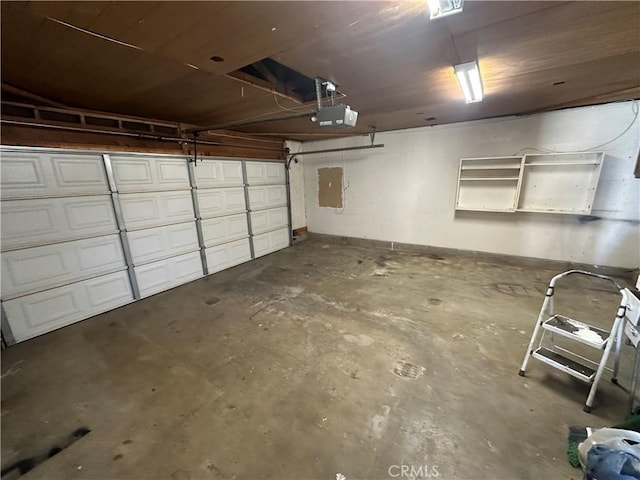 garage featuring a garage door opener and electric panel