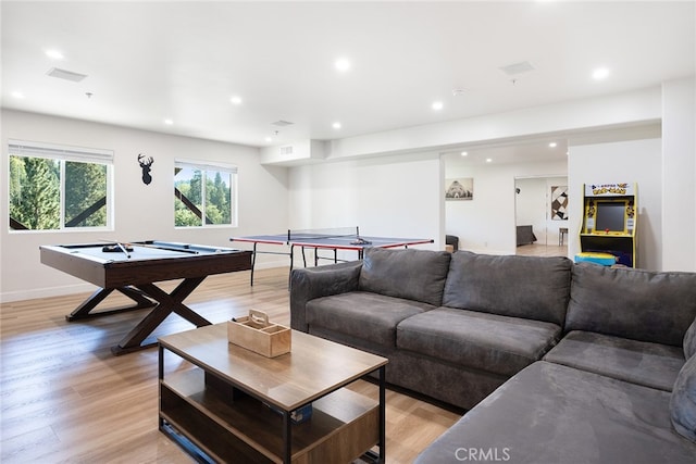 living room featuring billiards and light wood-type flooring