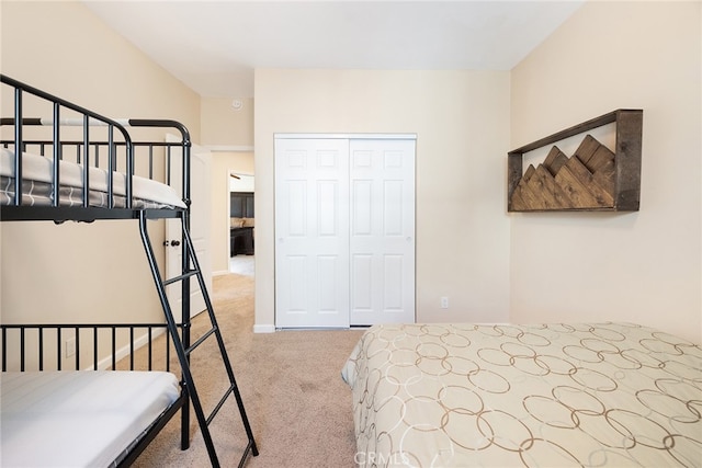 carpeted bedroom with a closet