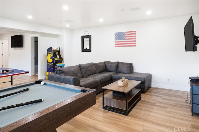 living room with billiards and light wood-type flooring