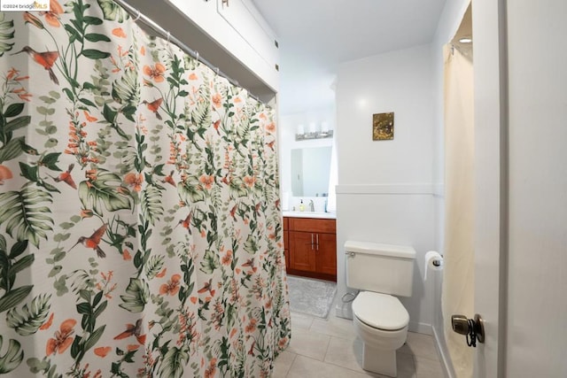 bathroom featuring vanity, a shower with curtain, toilet, and tile patterned flooring