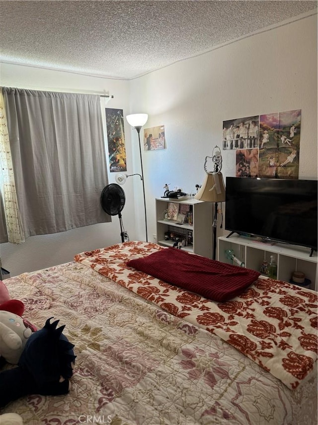 carpeted bedroom featuring a textured ceiling