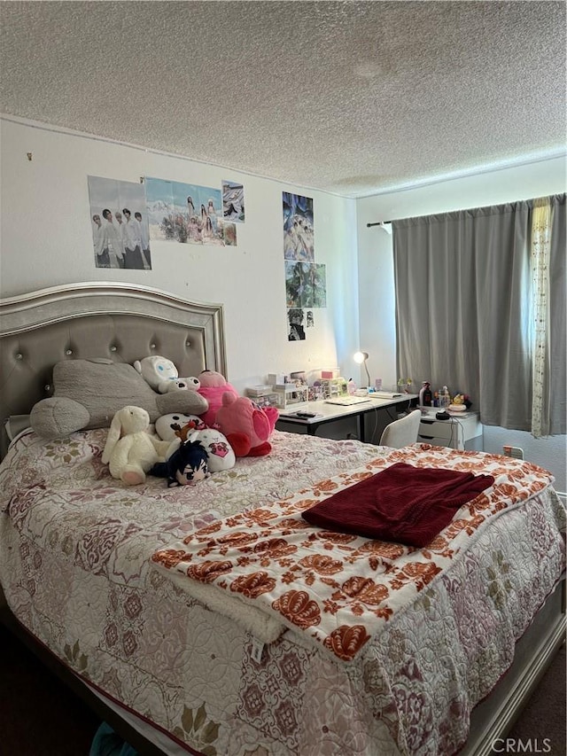 bedroom featuring a textured ceiling