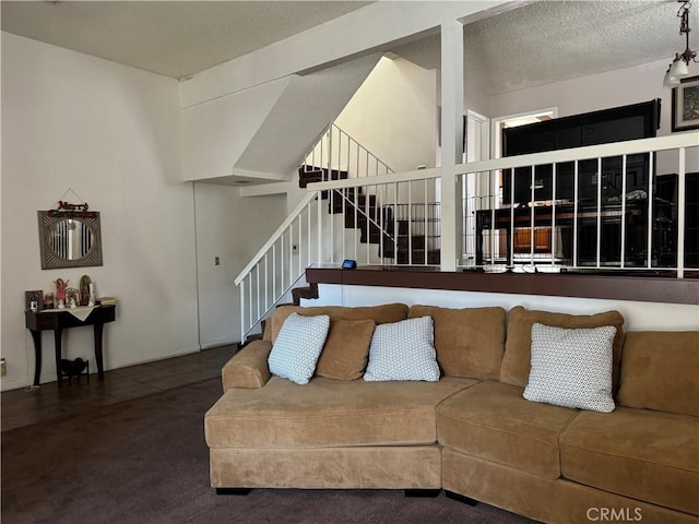 carpeted living room with a textured ceiling