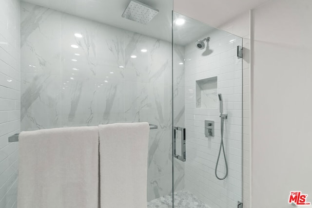 bathroom featuring an enclosed shower