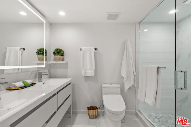 bathroom featuring vanity, toilet, and walk in shower