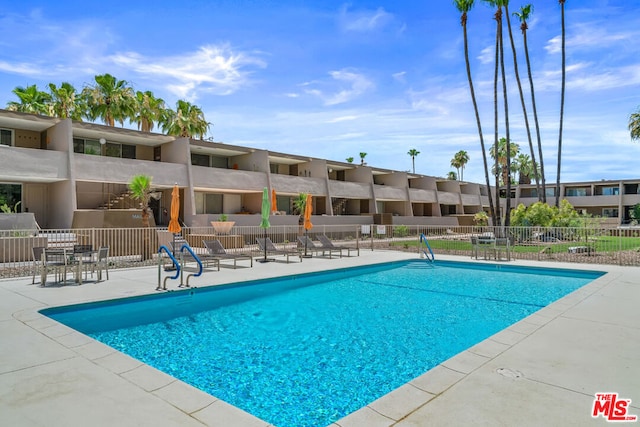 view of swimming pool featuring a patio