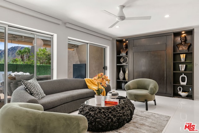 living room featuring ceiling fan, built in features, and light tile patterned floors