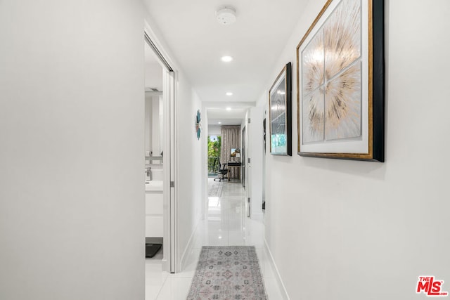 corridor with light tile patterned flooring