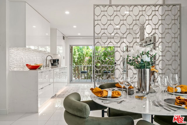 tiled dining space with sink