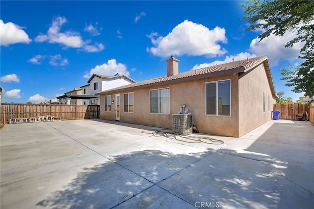 back of property with a patio area