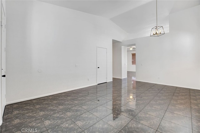 spare room with lofted ceiling