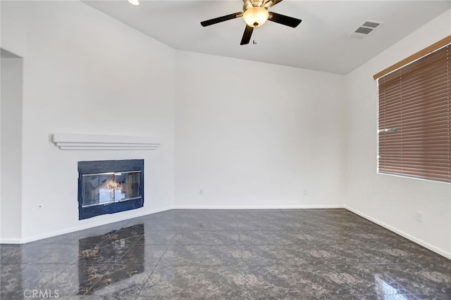 unfurnished living room with ceiling fan