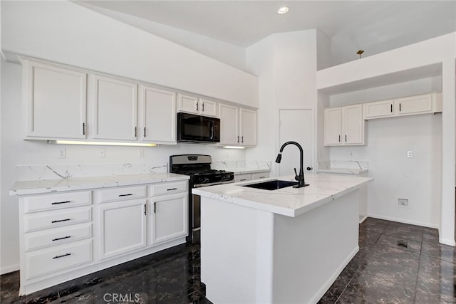 kitchen with a center island with sink, sink, white cabinets, and range with gas cooktop