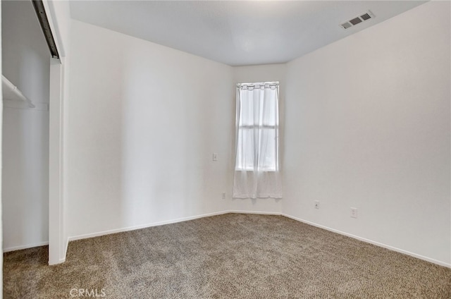 spare room featuring carpet floors