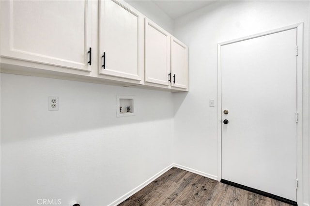 washroom featuring cabinets, hookup for a washing machine, and dark hardwood / wood-style floors