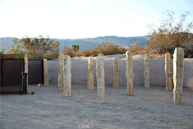 exterior space with a mountain view and carpet flooring