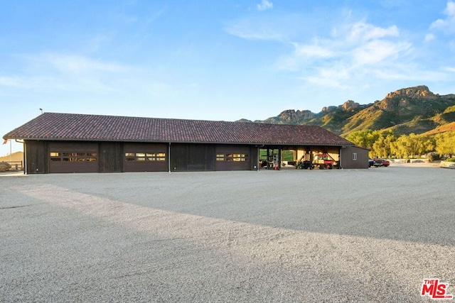 view of front of house with a mountain view and a garage