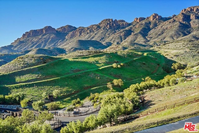 view of mountain feature with a rural view