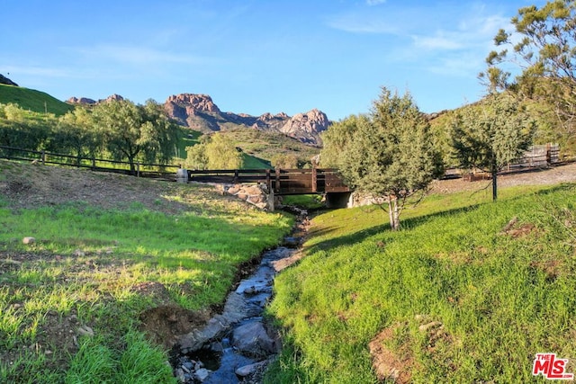 property view of mountains featuring a rural view